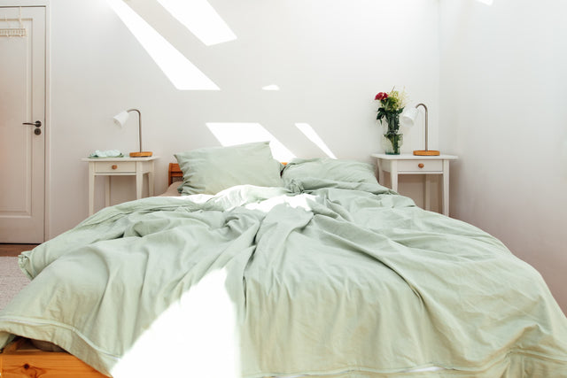 Novaline verzwaringsdeken met hoes katoen groen bed onopgemaakt